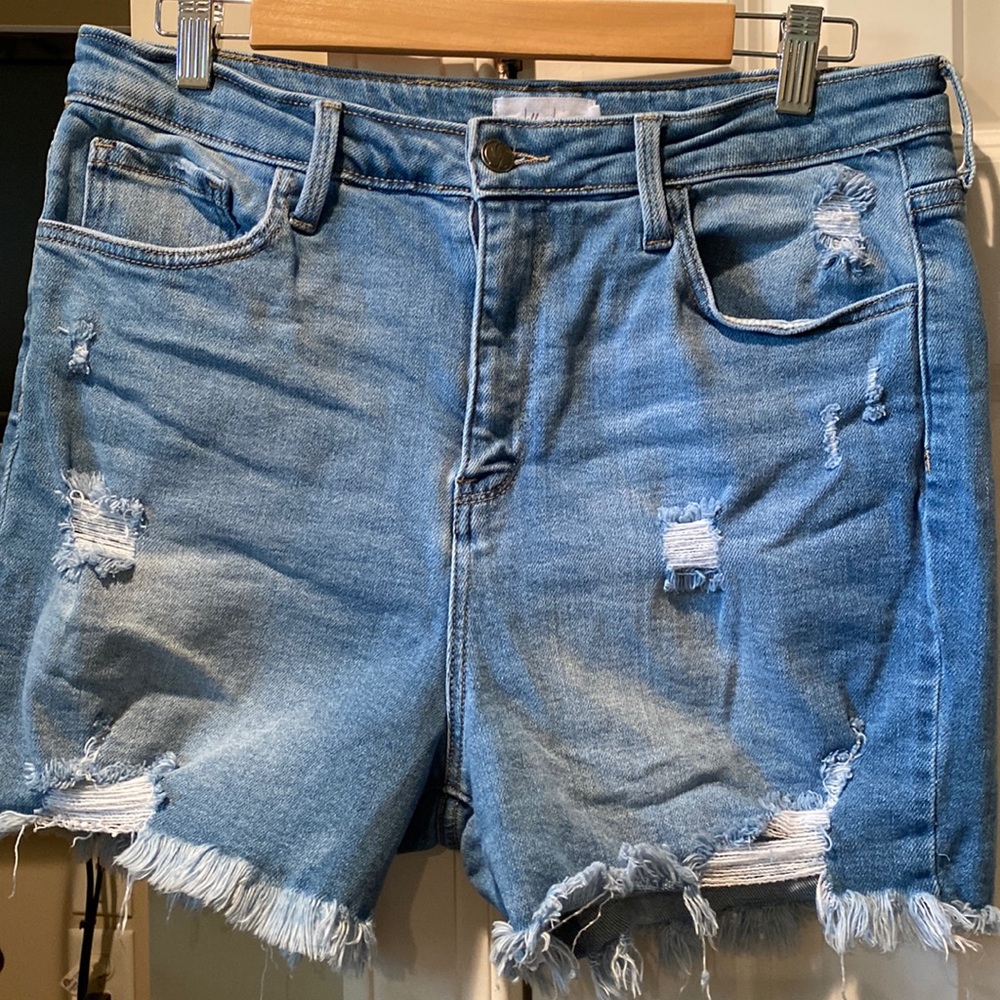 Light washed distressed denim shorts. They are stretchy.